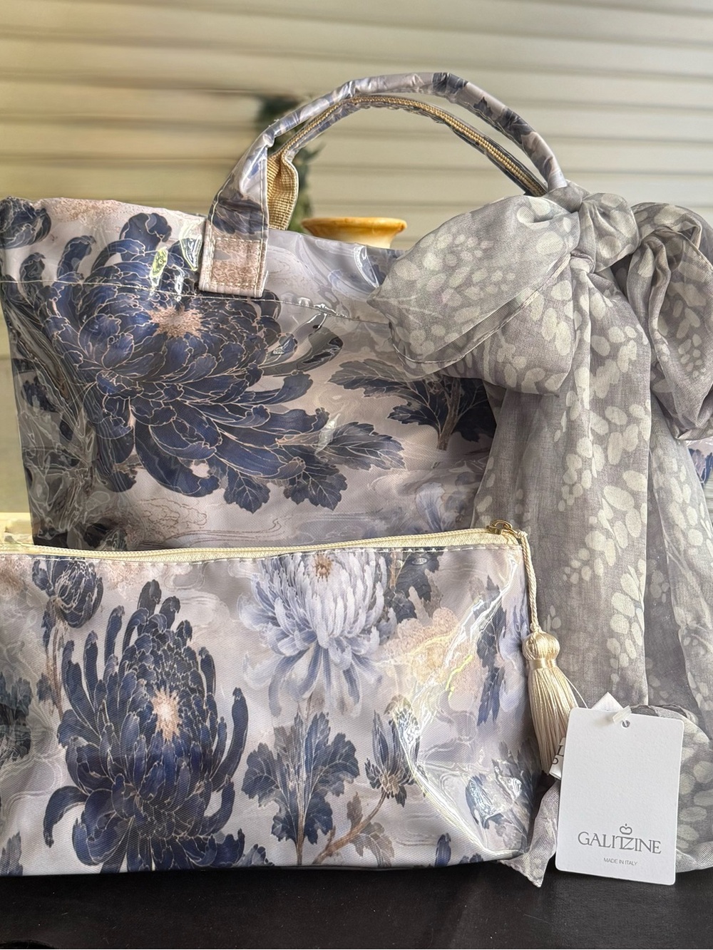 Beautiful botanical scene handbag with matching cosmetic case and accent scarf.
